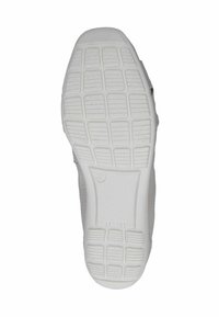 Suela de sneaker blanca con un patrón de agarre texturizado, con indentaciones rectangulares y ovaladas, y una zona de puntera lisa. Tamaño marcado como 37.