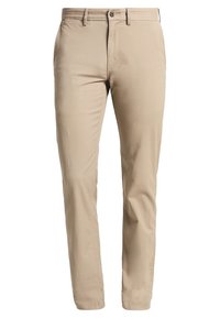 Bežové chinos kalhoty vyrobené z lehké bavlněné tkaniny. Design se slim fit střihem, standardní pět kapsový styl a jednobarevné zapínání na knoflík.