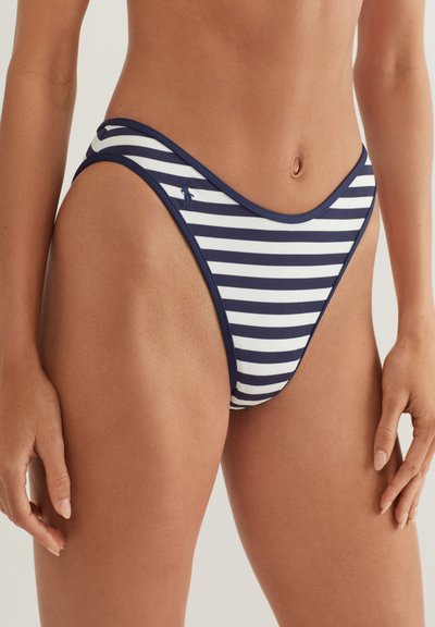 Tamsiai mėlynos ir baltos dryžuotos bikinio kelnaitės su aukštai iškirptomis šoninėmis dalimis ir lygiu, tampriu audiniu. Subtilus logotipo akcentas kairiajame klube.