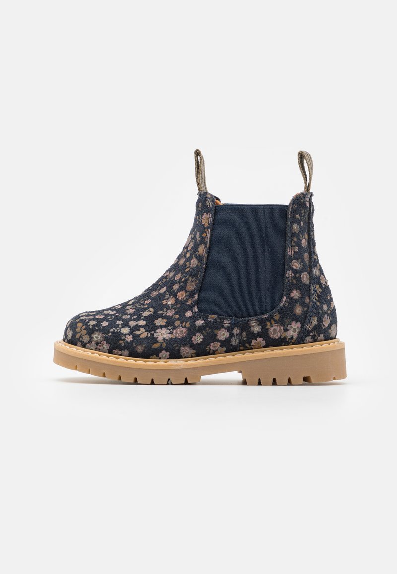 Navy floral print Chelsea boot with stretchy side panels, textured fabric, and a beige rubber sole with treads for grip.