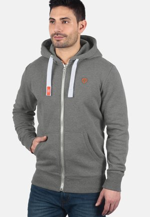 Gray zip-up hoodie with front pockets, white drawstrings, and an orange logo. Soft fabric with ribbed cuffs and hem.