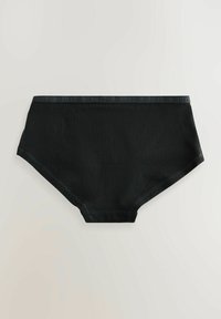 Svart högmidjad underkläder tillverkad av ett slätt tyg. Har ett mönstrat elastiskt midjeband och avslutade sömmar. Inga synliga sömmar.