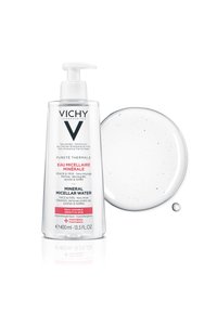 Clear plastic pump bottle featuring Mineral Micellar Water, labeled for sensitive skin. Accompanied by a clear droplet of the product.