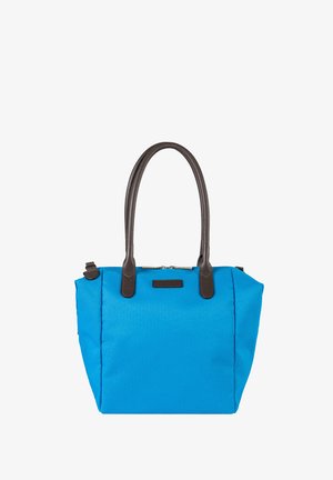 Blue fabric tote bag with two dark brown leather handles and zipper closure on top against white background.