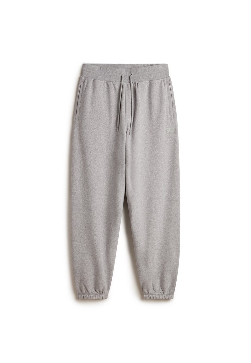 Grijze sweatpants van zacht materiaal, met een elastische tailleband met koord, zijzakken en elastische boorden bij de enkels.