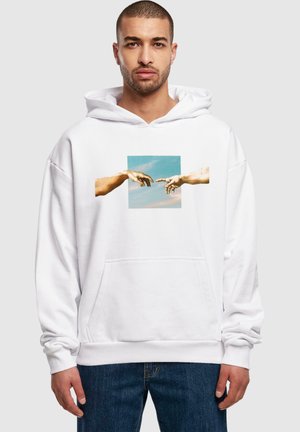White hoodie made of cotton blend featuring a printed design of hands reaching towards each other against a sky background. Front pocket included.