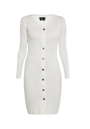 Valkoinen uritettu neulemekko, jossa on V-pääntie, pitkät hihat ja etuvetoketju, jossa on kontrastiväri kultaisia ja mustia nappeja.