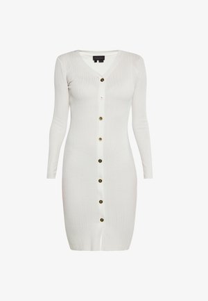 Valkoinen uritettu neulemekko, jossa on V-pääntie, pitkät hihat ja etuvetoketju, jossa on kontrastiväri kultaisia ja mustia nappeja.