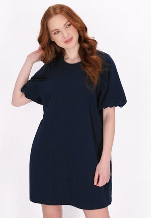 Navyblaues, übergroßes T-Shirt-Kleid mit kurzen Puffärmeln und rundem Ausschnitt. Glatte Stoffe mit legerer Passform und Länge oberhalb des Knies.