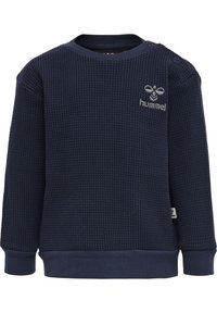 Mörkblå sweatshirt med våffelstruktur, rund halsringning, ribbade muddarna och broderad logotyp på bröstet. Tryckknappar på axeln.