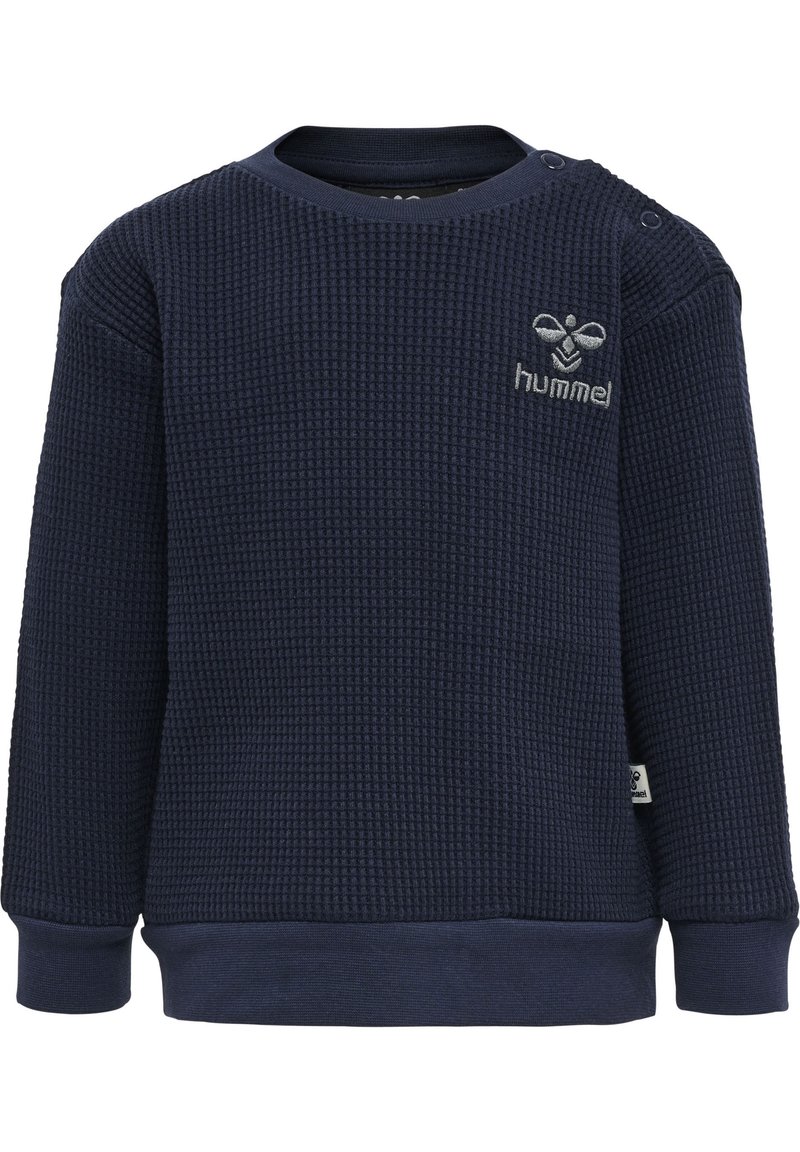 Mörkblå sweatshirt med våffelstruktur, rund halsringning, ribbade muddarna och broderad logotyp på bröstet. Tryckknappar på axeln.