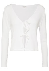 Cardigan blanc côtelé avec un col en V profond et des liens à l'avant. Manches longues et longueur courte, doté d'un tissu texturé.