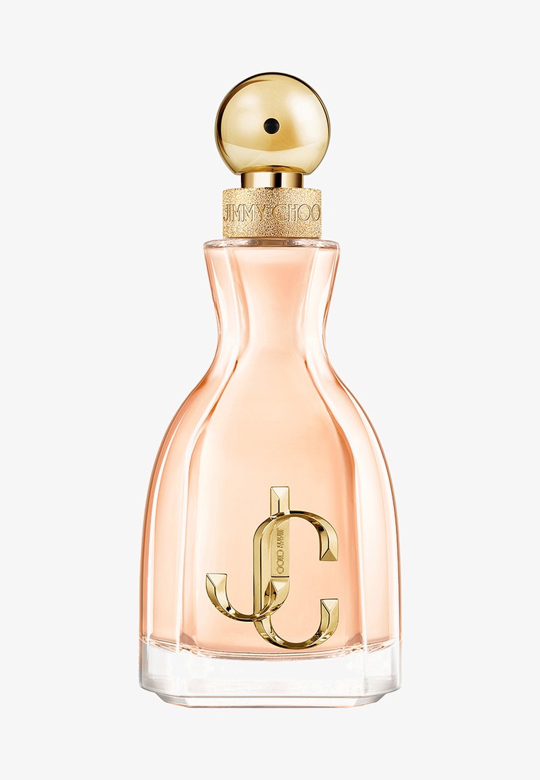 Bottiglia di profumo in vetro curvato con liquido rosa pallido, tappo sferico dorato e logo "JC" dorato sul davanti.