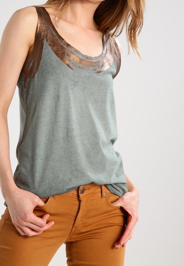 Gray tank top with metallic bronze accents at the neckline, paired with orange-brown fitted pants. Smooth fabric with a relaxed fit.