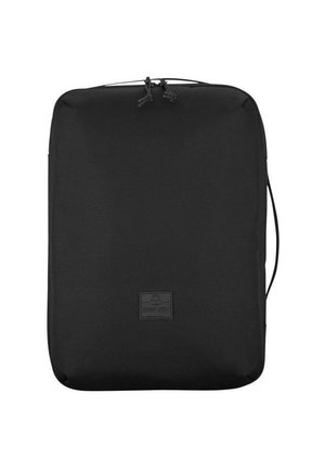 Black rectangular bag made of durable fabric; features a top handle and a small branding patch. Smooth texture with a simple design.