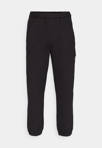 LEAGUE HURLEY - Tracksuit bottoms - black