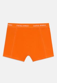 Bright orange boxer shorts with a white Jack & Jones logo on the waistband, displayed against a plain white background.