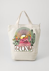 Borsa tote in canvas di colore naturale, con una grafica colorata del deserto che presenta cactus, montagne e un sole, con la dicitura "ROXY" in basso.