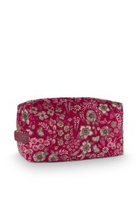 Rechteckige rosa Stofftasche mit braunem Blumenmuster und seitlichem Schlaufengriff, vor weißem Hintergrund dargestellt.
