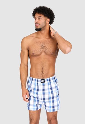Boxer shorts in a blue and white plaid pattern, featuring a soft fabric, elastic waistband, and a logo tag at the front.