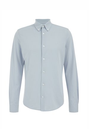 Camicia a maniche lunghe azzurro chiaro con colletto abbottonato, realizzata in tessuto morbido. Dispone di sette bottoni sul davanti e di un piccolo logo sul petto.