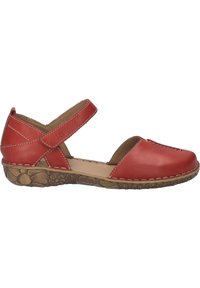 Chaussure plate style Mary Jane en cuir rouge avec bride de cheville réglable et semelle en caoutchouc brun texturée à motifs floraux.