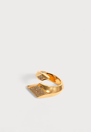 Gold open-ended ring with two diamond-shaped ends, each adorned with small clear crystals, set on a plain light background.