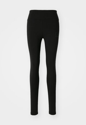 Zwarte leggings van rekbaar materiaal, met een hoge taille en een discrete logo met strass aan de linkerkant.