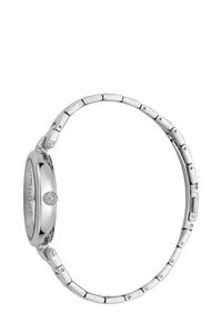 Orologio da polso in metallo argentato con cassa rotonda, bracciale a maglie e corona texturizzata. Il design presenta una superficie liscia e lucida.