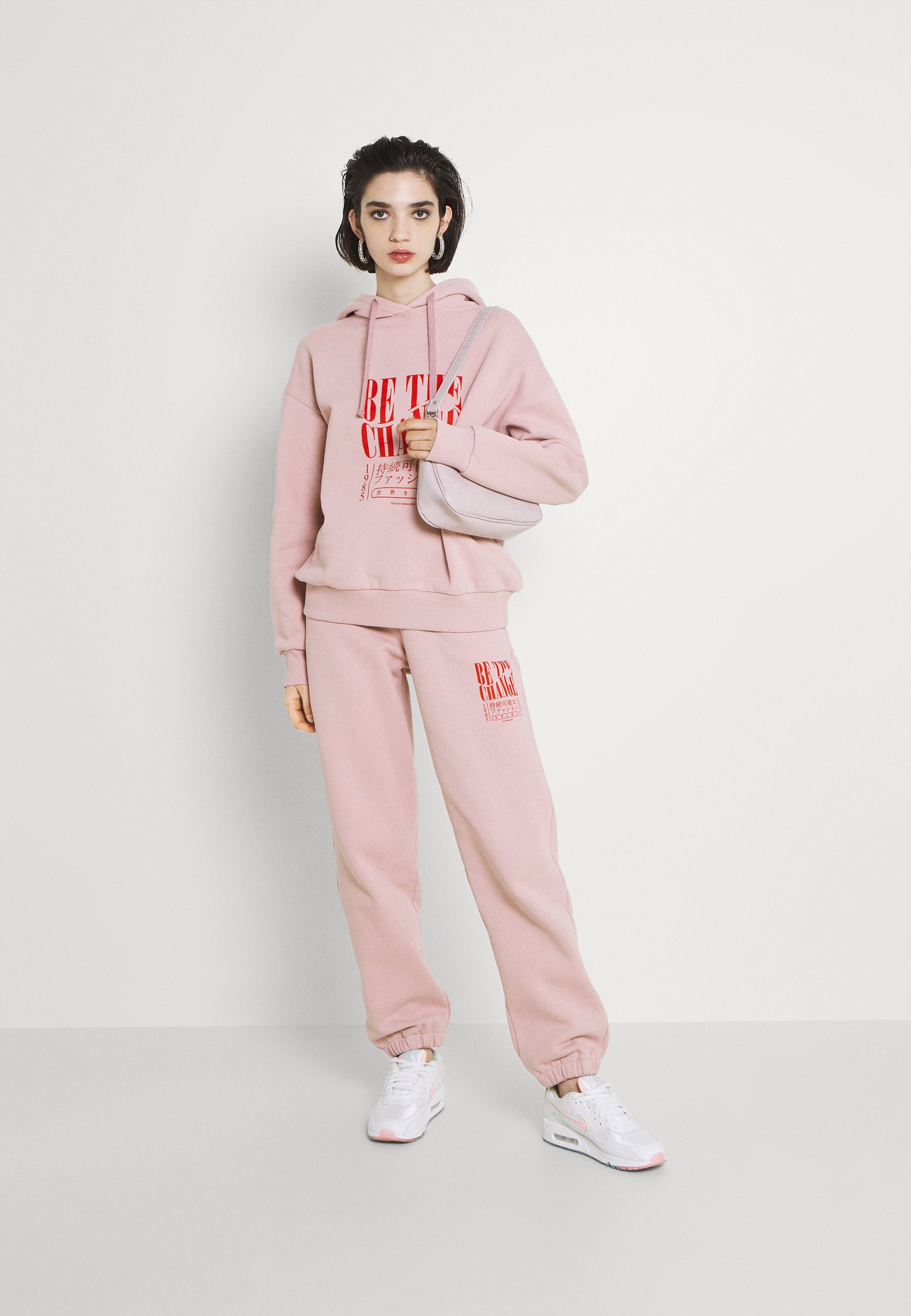 light pink tracksuit