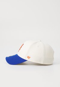 Baseball cap with a white body and a blue visor. Features orange embroidery on the front and side, made of cotton with a structured fit.