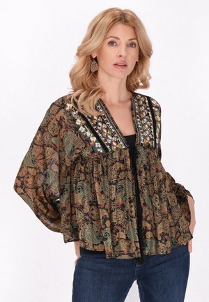 Pitkähihainen, kuviollinen blusa, jossa on musta pohja ja paisley-kuvio vihreänä, oranssina ja valkoisena. Koristeltu koristeommellaan.
