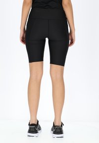 Swedemount GYM SHORTS TIGHTS W - Shorts - black