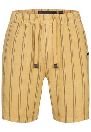 Shorts jaunes rayés en tissu avec un waistband élastique et un cordon de serrage. Caractéristiques de fines rayures verticales noires et un design décontracté.