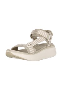 Beige sandal med tygremmar som har ett texturerat mönster, en vadderad sula och en något upphöjd klack för komfort och stöd.