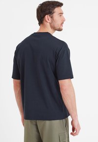 Short sleeve navy T-shirt in cotton, featuring a crew neckline and a relaxed fit. Smooth texture with no visible patterns or accents.