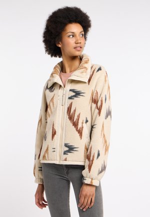 Fleece jacket with a beige base and multicolored zigzag patterns in brown, gray, and burnt orange; features a zip closure and high collar.