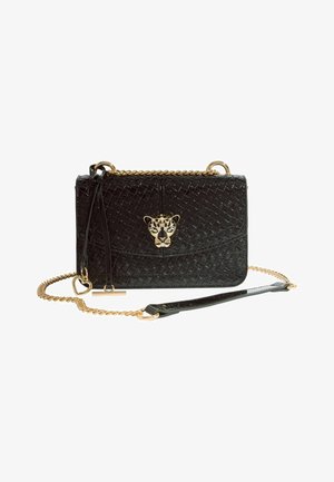 Black quilted leather crossbody bag with gold chain strap, gold leopard head clasp, and heart-shaped charm detail.