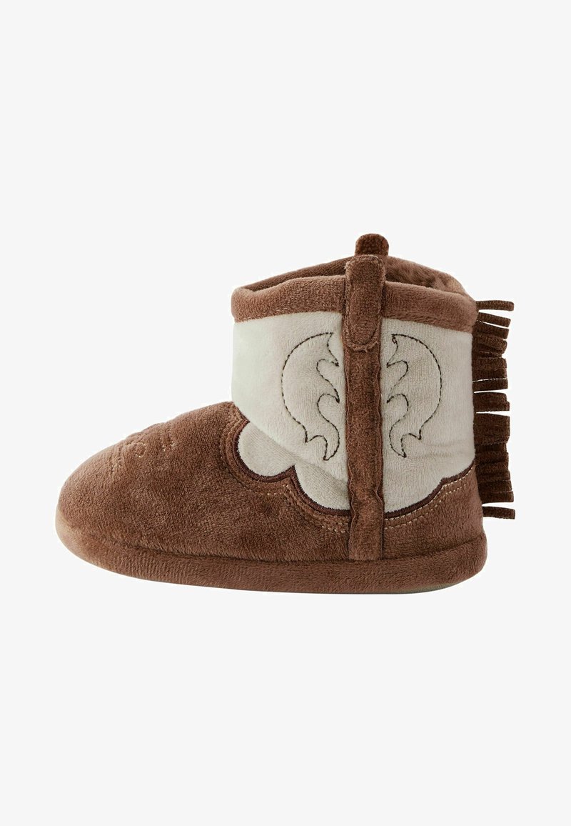 Brown and beige soft slipper with a rounded toe, suede material, fringe detail on the back, and embroidered design on the side.