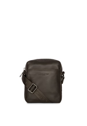 Dark brown leather crossbody bag with a textured finish, adjustable strap, and a silver zipper. Features embossed logo on the front.
