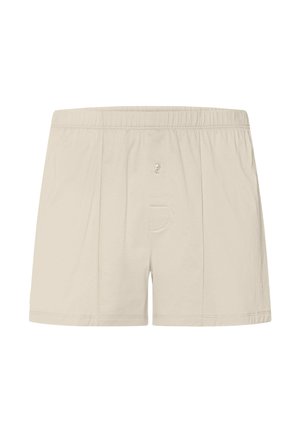 Pánské béžové boxerky s elastickým páskem a zapínáním na knoflíky vpředu, zobrazené na bílém pozadí.