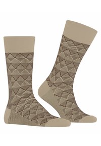 Beige Socken mit einem geometrischen braunen Muster, gerippten Bündchen und verstärkten Zehen. Das Material wirkt weich und elastisch für zusätzlichen Komfort.