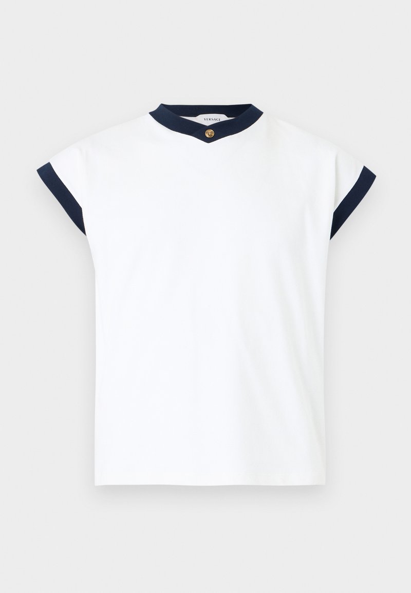 White sleeveless top with navy trim on collar and sleeve edges, featuring a small gold button at the neckline.