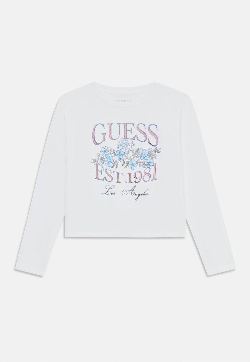 Weißes langärmliges Cropped-Top mit floralem Grafikdesign, das blaue Blumen und den Aufdruck "GUESS EST. 1981 Los Angeles" in mehrfarbigem Druck zeigt.