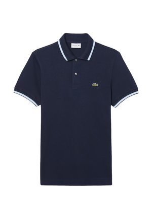 Mörkblå pikétröja i bomull med klassisk krage, två knappar och ljusblå detaljer på kragen och ärmarna. Har en grön logotyp.