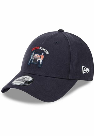 Navy blue cap with a curved brim, embroidered "United Review" logo, and graphic design. Fabric texture is smooth; features adjustable back strap.