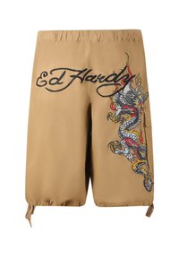 Kratasy v barvě tan s elastickým pasem, na jedné straně zdobené barevným vyšitým drakem a s nápisem "Ed Hardy" v tučných černých písmenech.