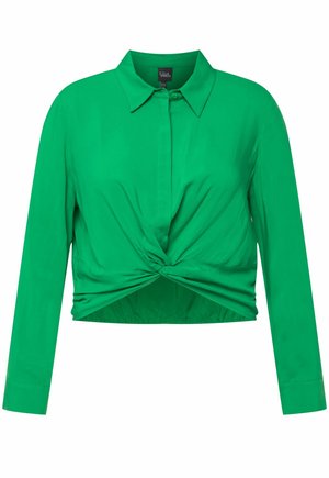 Grøn, cropped skjorte med detaljeret twist foran, lange ærmer og spidse kraver. Fremstillet af et glat, let vævet stof.