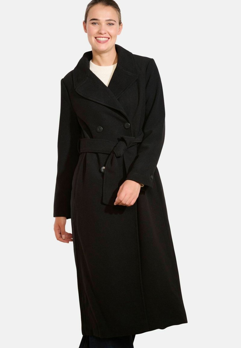 Czarny płaszcz trench z mieszanki wełny, z podwójnymi guzikami, szerokimi klapami i paskiem do wiązania. Długie rękawy i zwiewny krój.