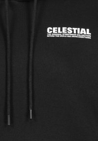 Black hoodie made of soft fabric featuring white text: "CELESTIAL" and "THE ORIGINAL STREETWEAR COLLECTION" above and below. Drawstrings included.